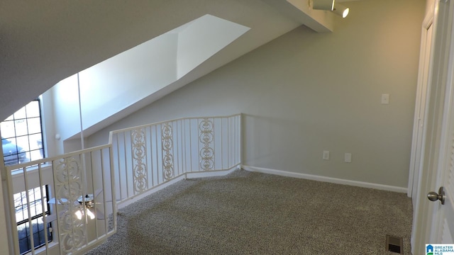 bonus room with visible vents, baseboards, beam ceiling, carpet flooring, and high vaulted ceiling