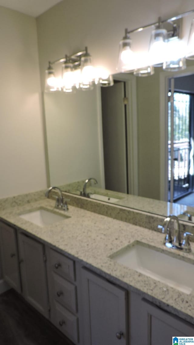 bathroom with double vanity and a sink