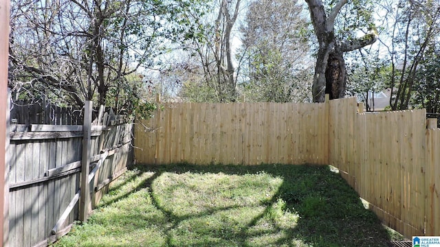 view of yard featuring a fenced backyard