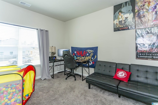 carpeted bedroom featuring visible vents and baseboards