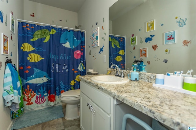 full bathroom featuring vanity, curtained shower, and toilet