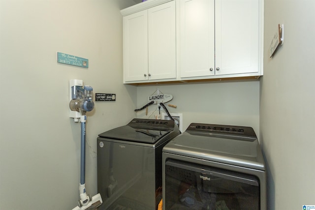 laundry area with cabinet space and washing machine and dryer