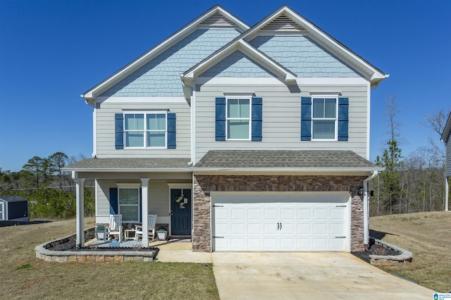 craftsman house with stone siding, a porch, concrete driveway, a shingled roof, and a garage