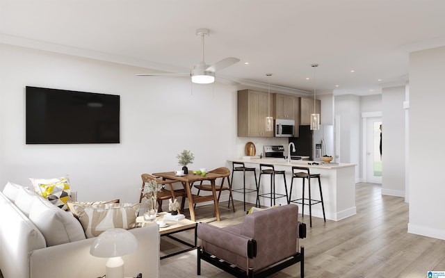 living room featuring recessed lighting, a ceiling fan, light wood-type flooring, and baseboards