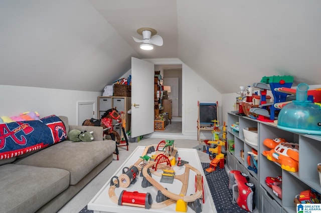 recreation room featuring lofted ceiling and carpet