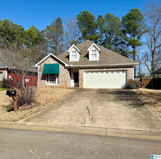 view of front of house featuring brick siding, concrete driveway, a garage, and a shingled roof