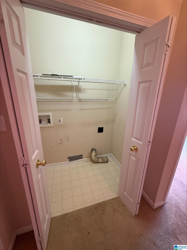 clothes washing area featuring electric dryer hookup, carpet, baseboards, hookup for a washing machine, and laundry area