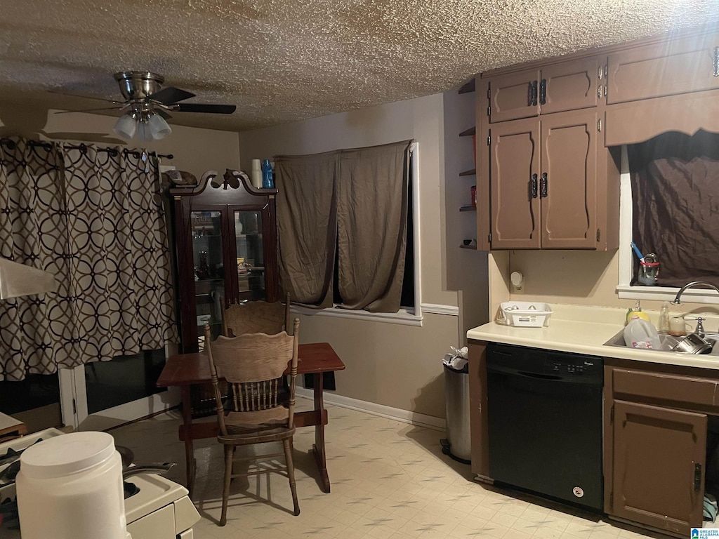 kitchen featuring light floors, ceiling fan, a sink, light countertops, and dishwasher