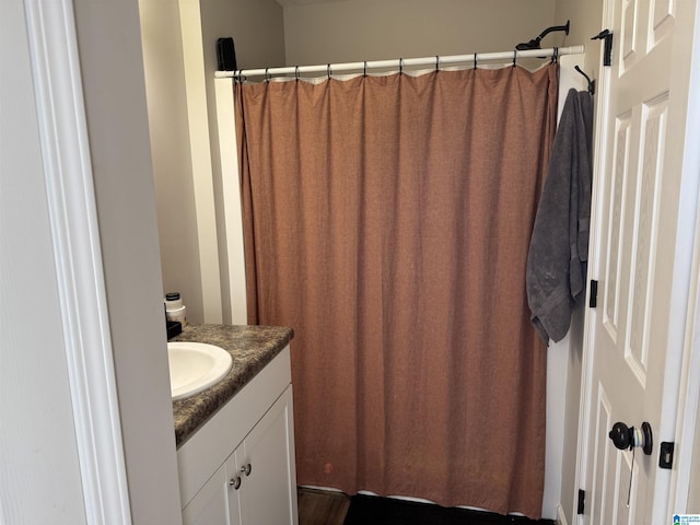 bathroom featuring vanity and a shower with curtain