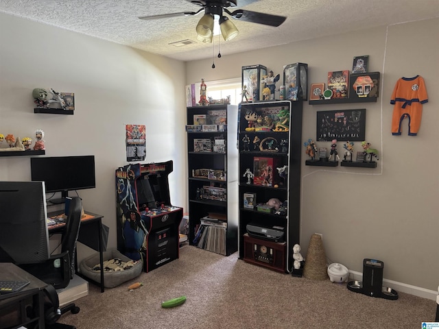 office featuring ceiling fan, carpet flooring, and a textured ceiling