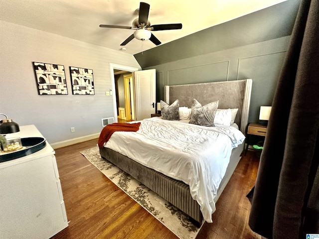 bedroom featuring visible vents, ceiling fan, baseboards, and wood finished floors