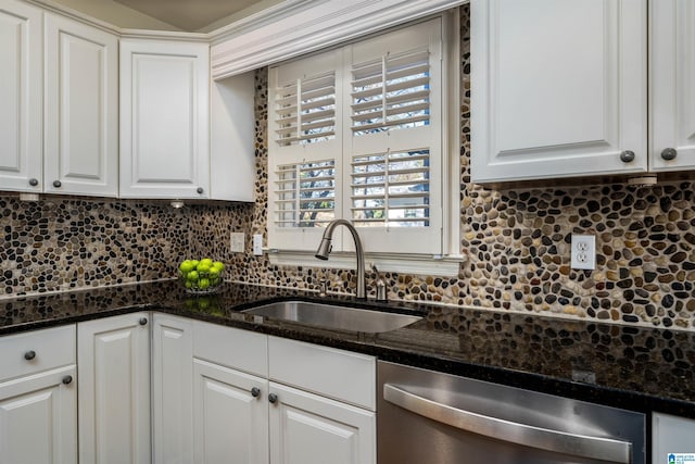 kitchen with a sink, backsplash, dishwasher, and white cabinets