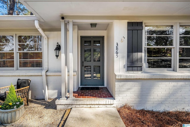 property entrance with brick siding