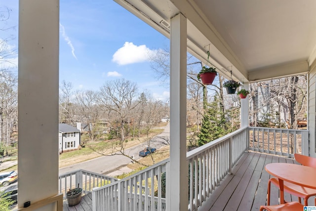 wooden terrace featuring a porch