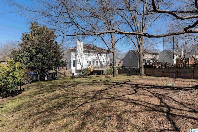 view of yard featuring a deck and a fenced backyard