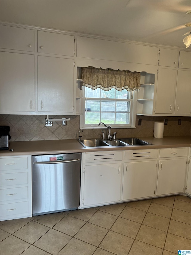 kitchen with a sink, backsplash, open shelves, and stainless steel dishwasher