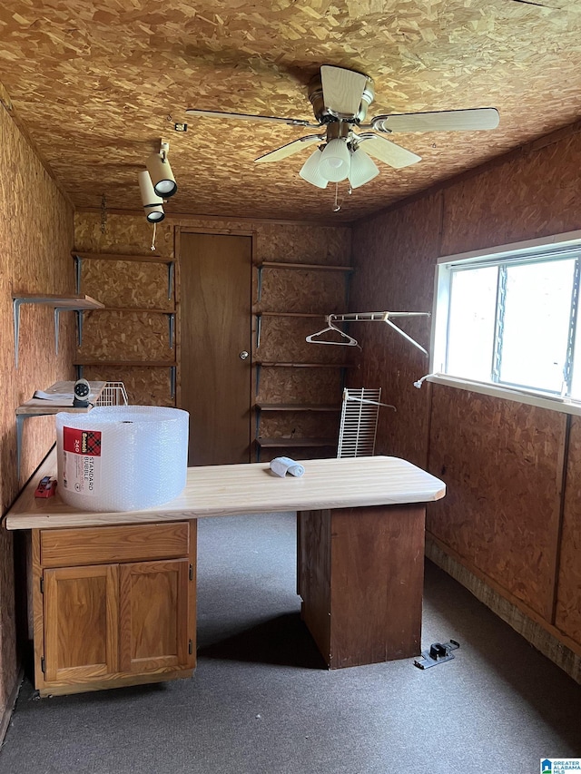 unfurnished office featuring ceiling fan