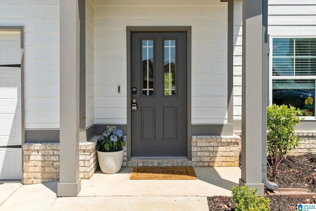 property entrance with stone siding