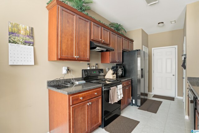 kitchen with dark countertops, black range with electric stovetop, stainless steel refrigerator with ice dispenser, and under cabinet range hood