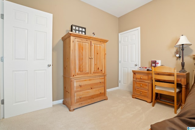 interior space with light colored carpet and baseboards