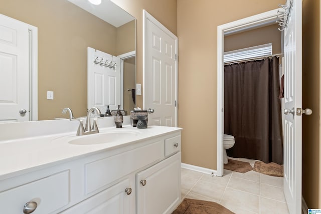 bathroom with curtained shower, baseboards, toilet, tile patterned floors, and vanity