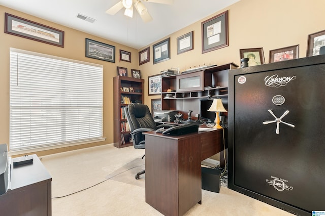 carpeted office space featuring a ceiling fan and visible vents