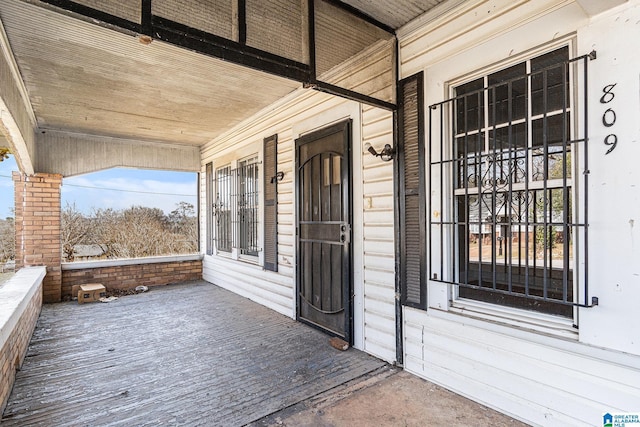 doorway to property with a porch