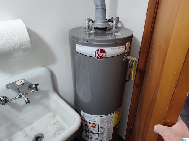 utilities with gas water heater and a sink