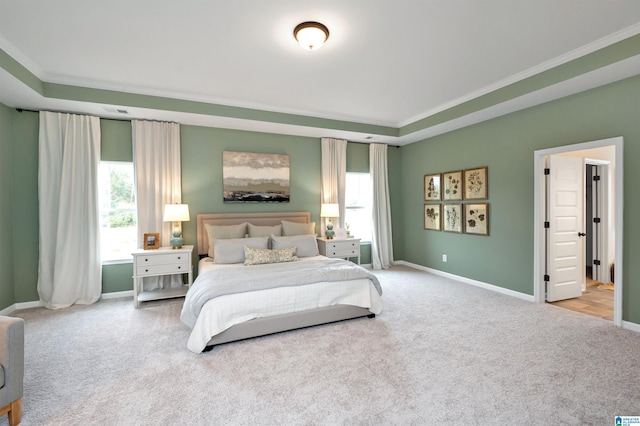 bedroom with multiple windows, crown molding, and carpet floors