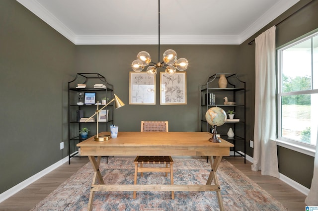 home office with wood finished floors, a wealth of natural light, and ornamental molding