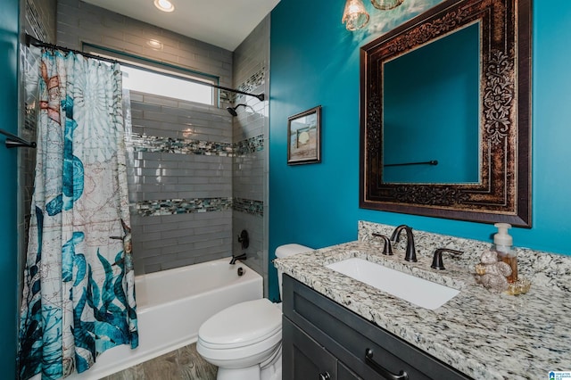 full bathroom with vanity, wood finished floors, toilet, and shower / bathtub combination with curtain