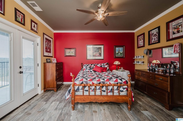 bedroom featuring french doors, visible vents, crown molding, and access to outside