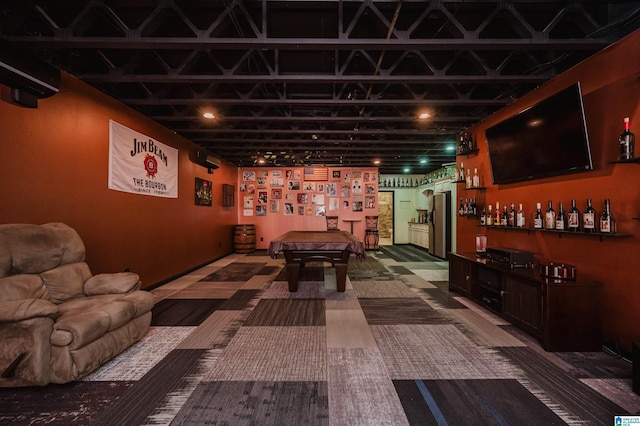 rec room featuring carpet flooring and a bar