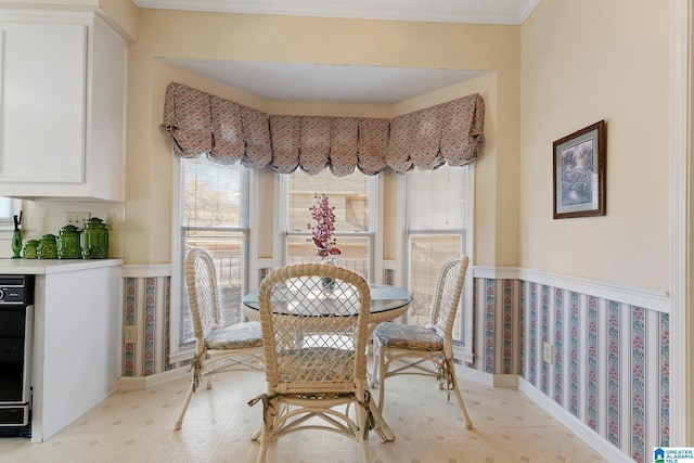 dining space with crown molding