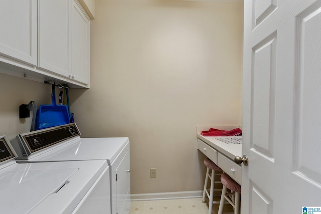 laundry area with washing machine and dryer, cabinet space, baseboards, and light floors