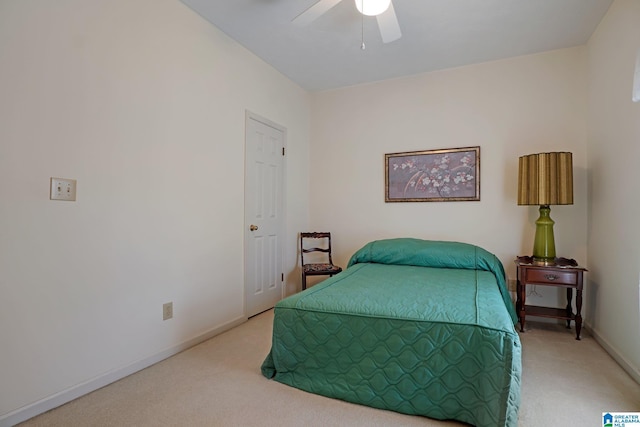 bedroom with ceiling fan, baseboards, and carpet