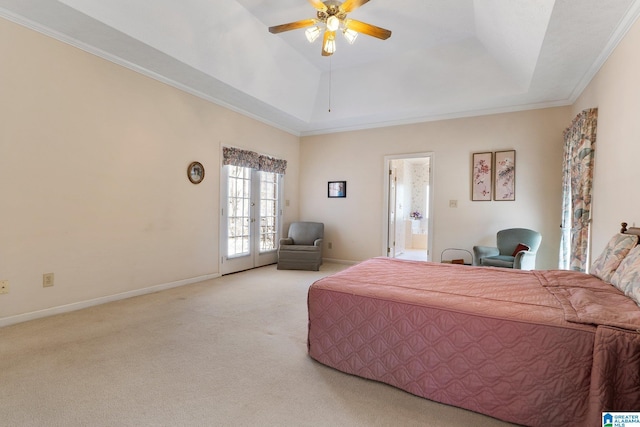 bedroom featuring carpet flooring, a raised ceiling, and baseboards