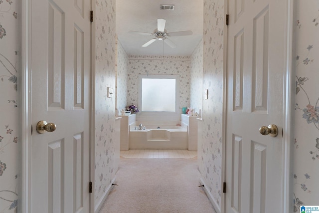 full bathroom featuring visible vents, a garden tub, a ceiling fan, and wallpapered walls