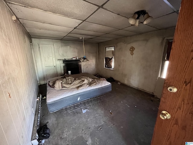 unfurnished bedroom with a drop ceiling