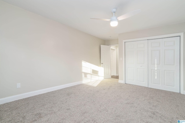 unfurnished bedroom featuring a closet, carpet flooring, ceiling fan, and baseboards