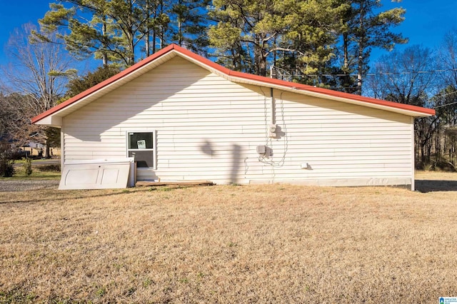 view of home's exterior with a lawn