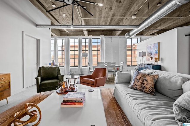 living room featuring concrete flooring and ceiling fan