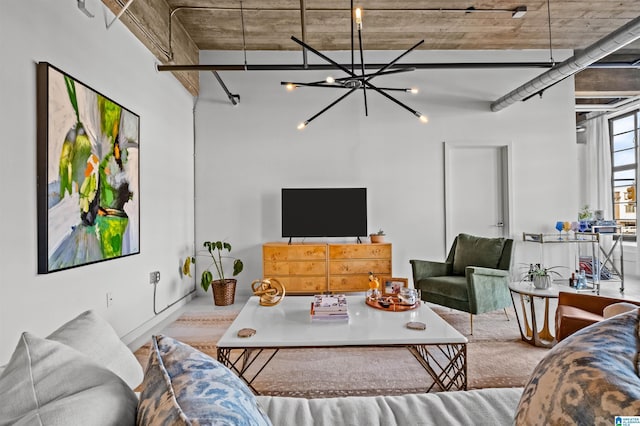 living area with an inviting chandelier