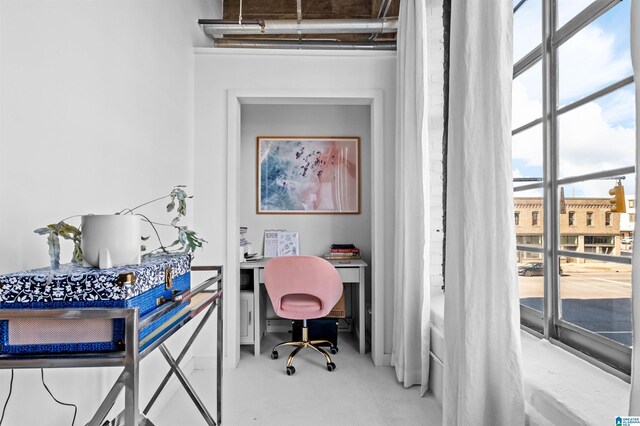 office space featuring finished concrete flooring