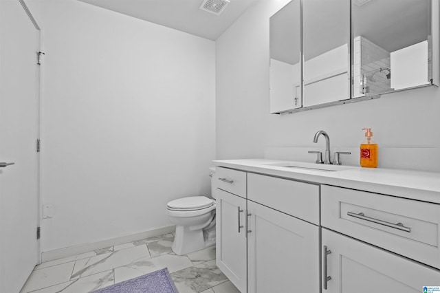 bathroom featuring visible vents, baseboards, toilet, marble finish floor, and vanity