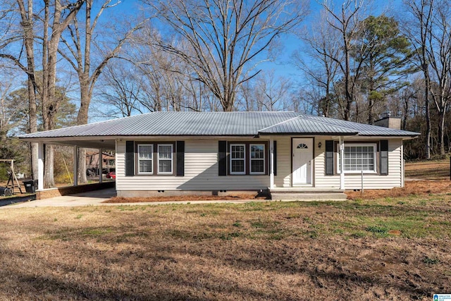 ranch-style house with metal roof, a front yard, crawl space, a carport, and a chimney