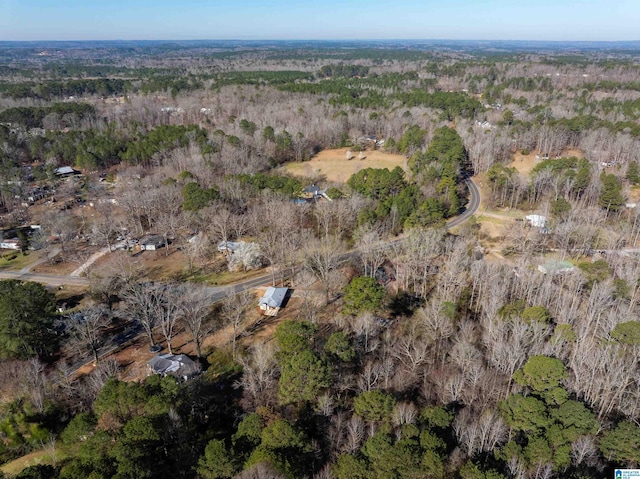 drone / aerial view featuring a forest view