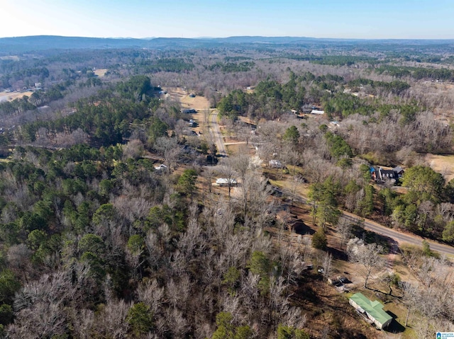 bird's eye view featuring a wooded view