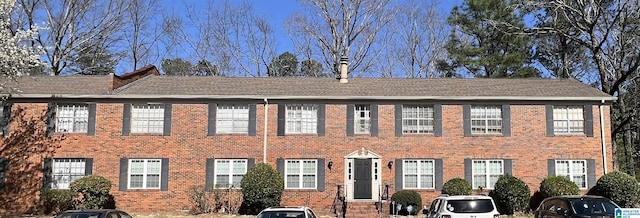 view of front of house with brick siding