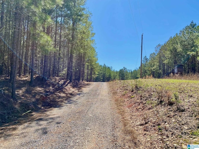 view of street with a wooded view